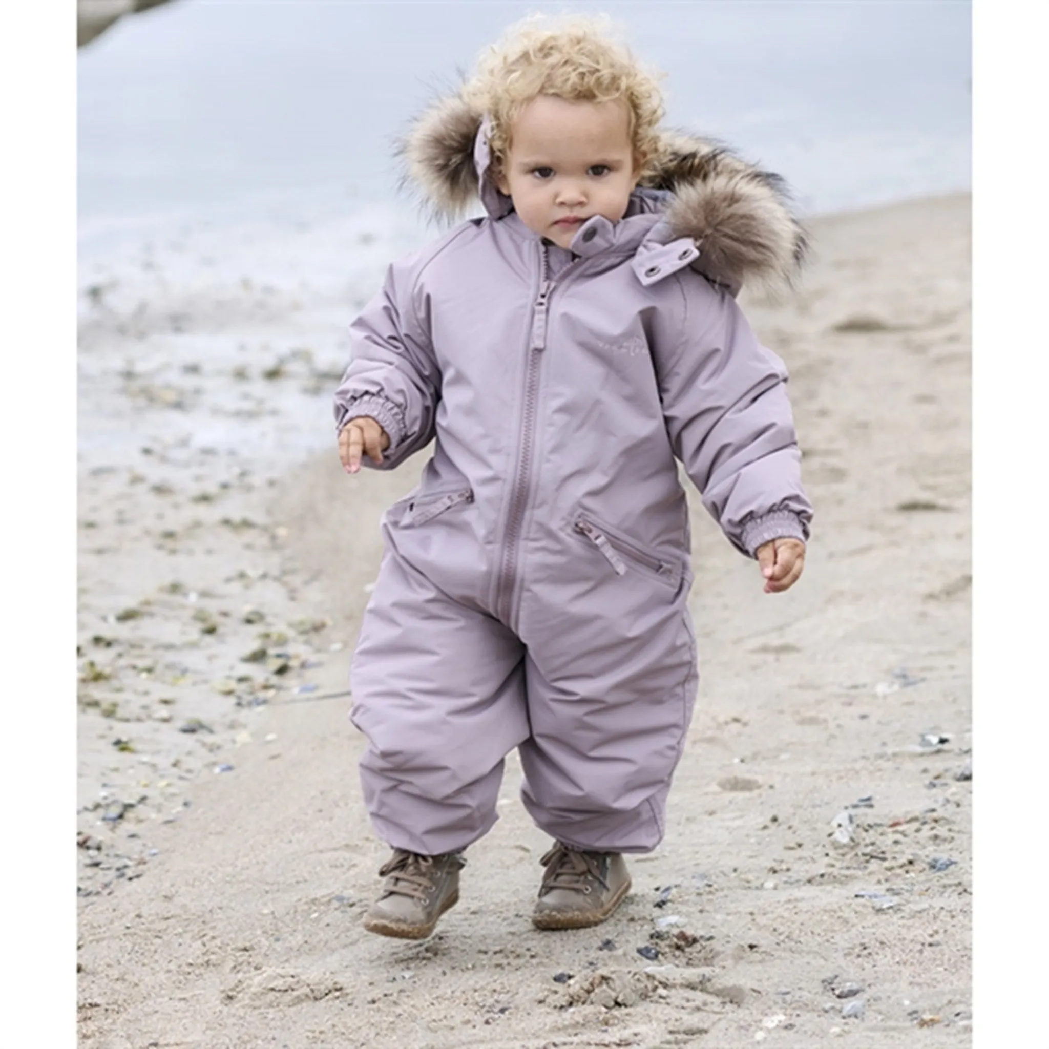 Ver de Terre Flyverdragt m. Pels Heather Hip-Flattering Flap-Detail